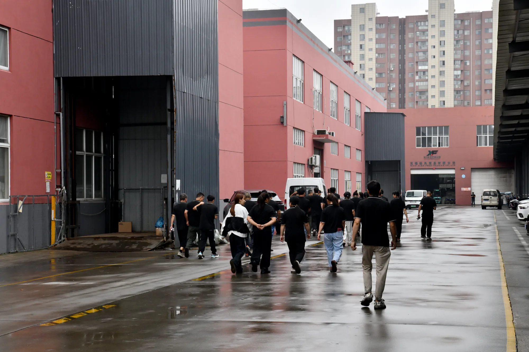 hongjueev team walking through the production base